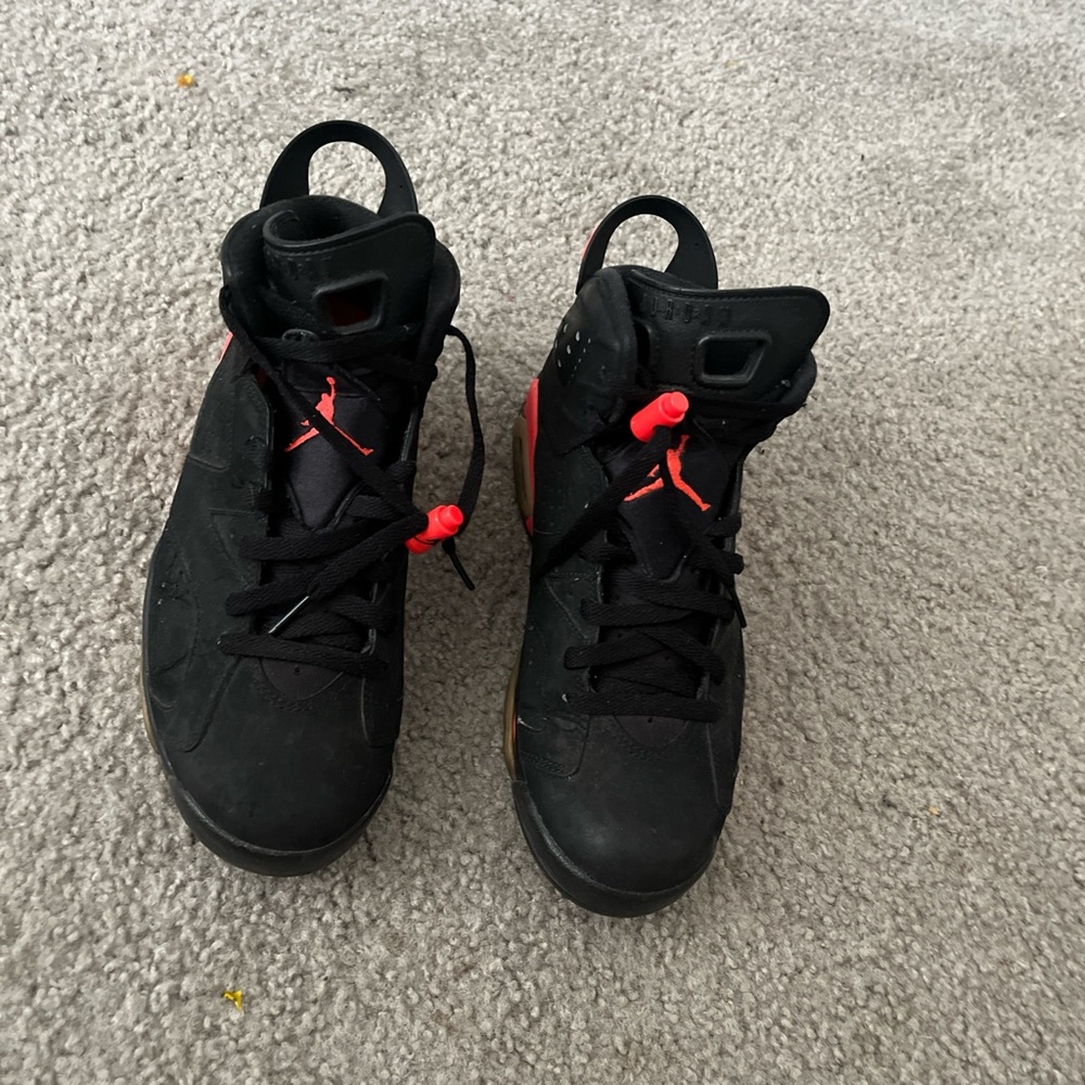 Black Sneakers with Red Accents